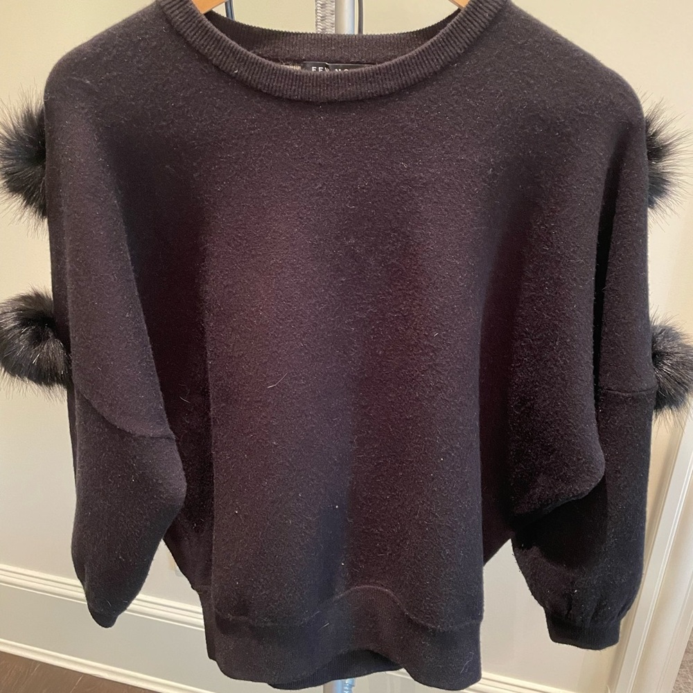 Black wool sweater with fur ball